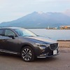 桜島をバックに記念撮影。